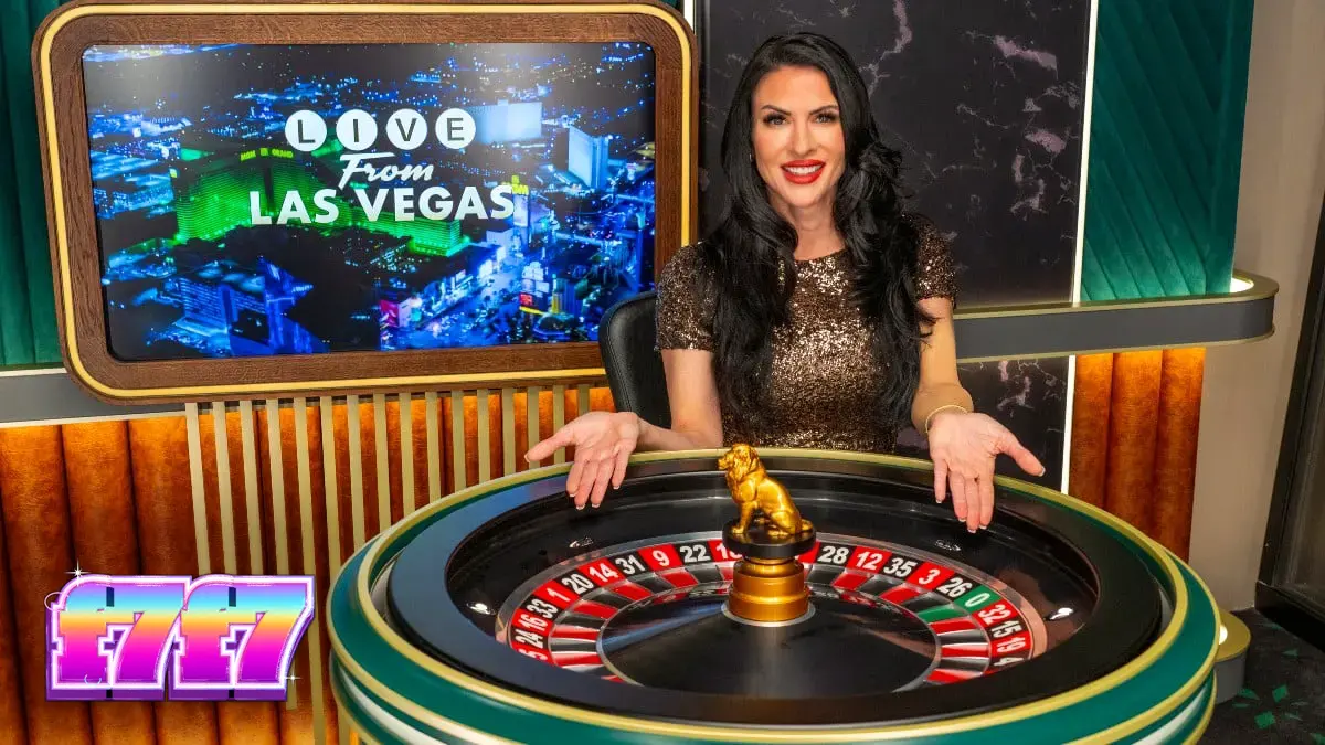 Suasana meja kasino live dealer dengan latar belakang kasino Las Vegas